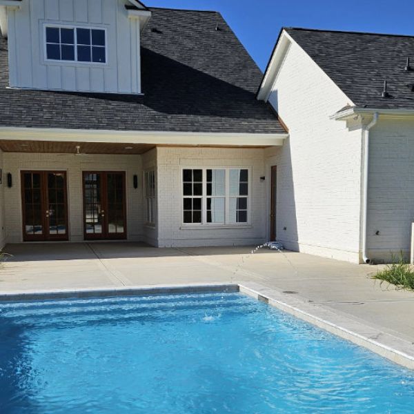 Swimming pool enhances the living experience in your custom home.